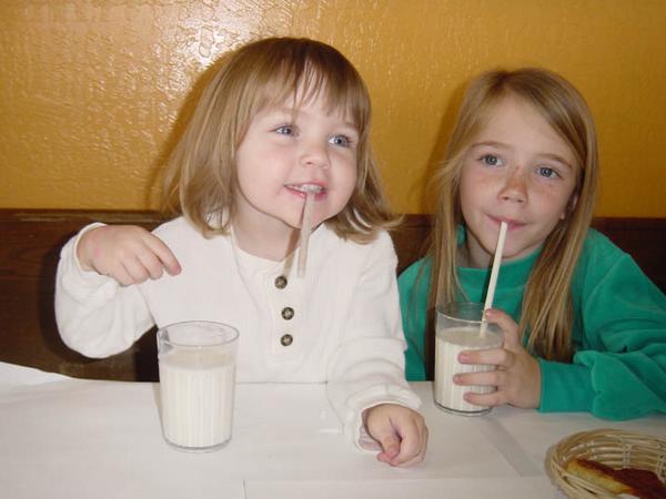 2002-03-10a Allie and Kylah happy with milk and scones.jpg