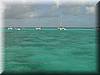 323 At our anchoring spot at the Tobago Cays... flat green water up to the reef.JPG
